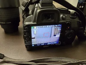 Nikon D3100 DSLR + 18-55mm VR Lens + 70-300mm Telephoto Lens + Bag