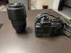 Nikon D3100 DSLR + 18-55mm VR Lens + 70-300mm Telephoto Lens + Bag
