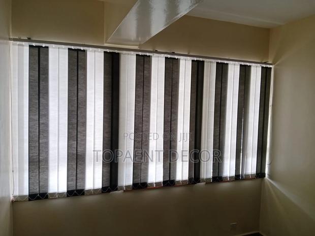 Brown and White Vertical Window Blinds