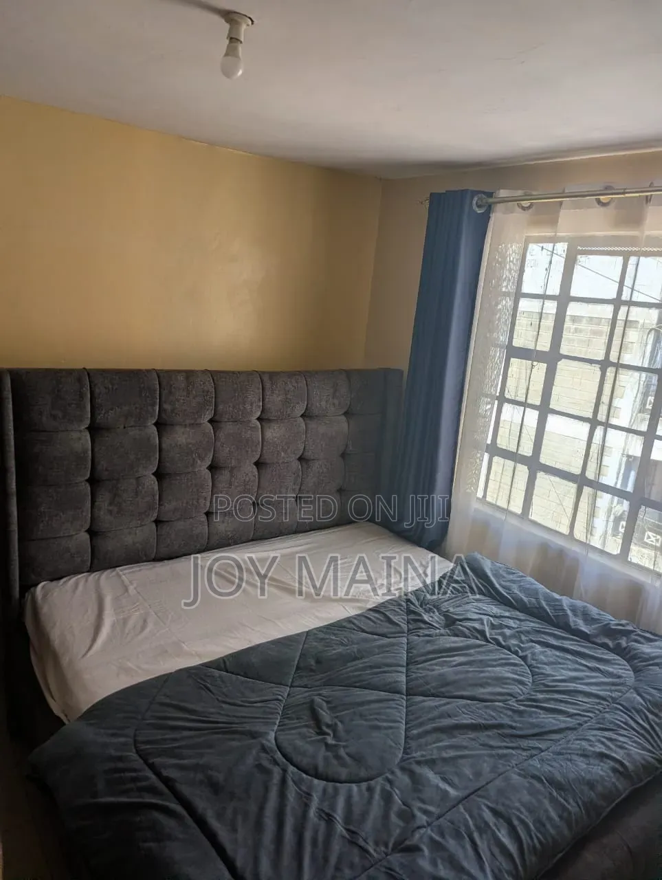 Modern 6x6 Upholstered Bed With a Charcoal Grey Tufted Headboard
