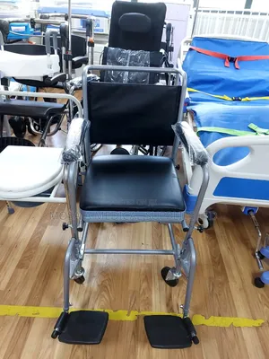Commode Chair With Backrest and Castors and Footrest