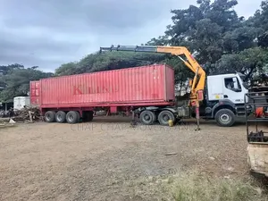 Trailer With Crane Readily Available for Logistics Services