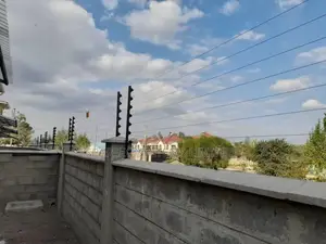 Wall Top Electric Fence Installation for 100 by 100 Plot