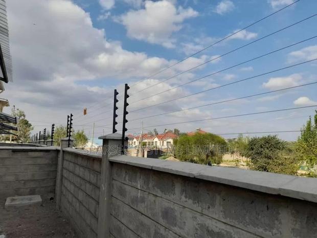 Wall Top Electric Fence Installation for 100 by 100 Plot