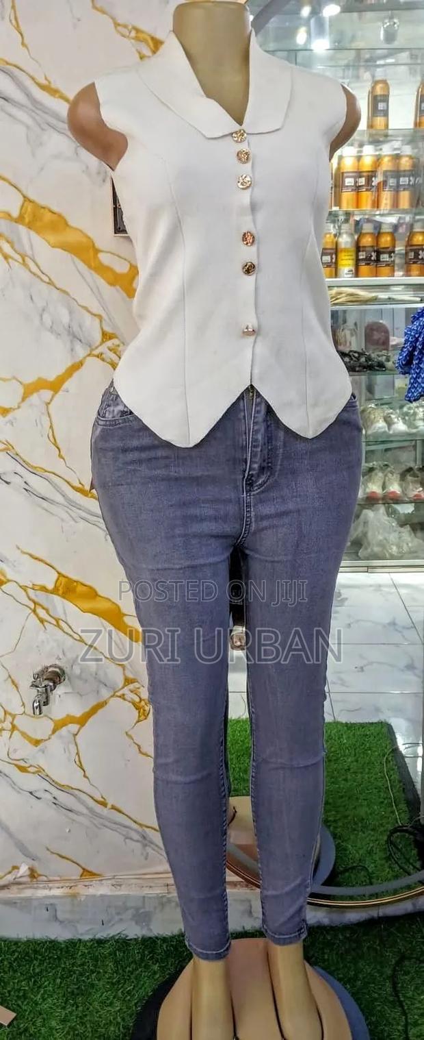 Lady's Fitting Jeans and Blouse