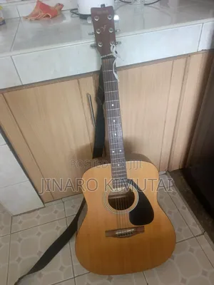 Yamaha Acoustic Guitar With a Capo.