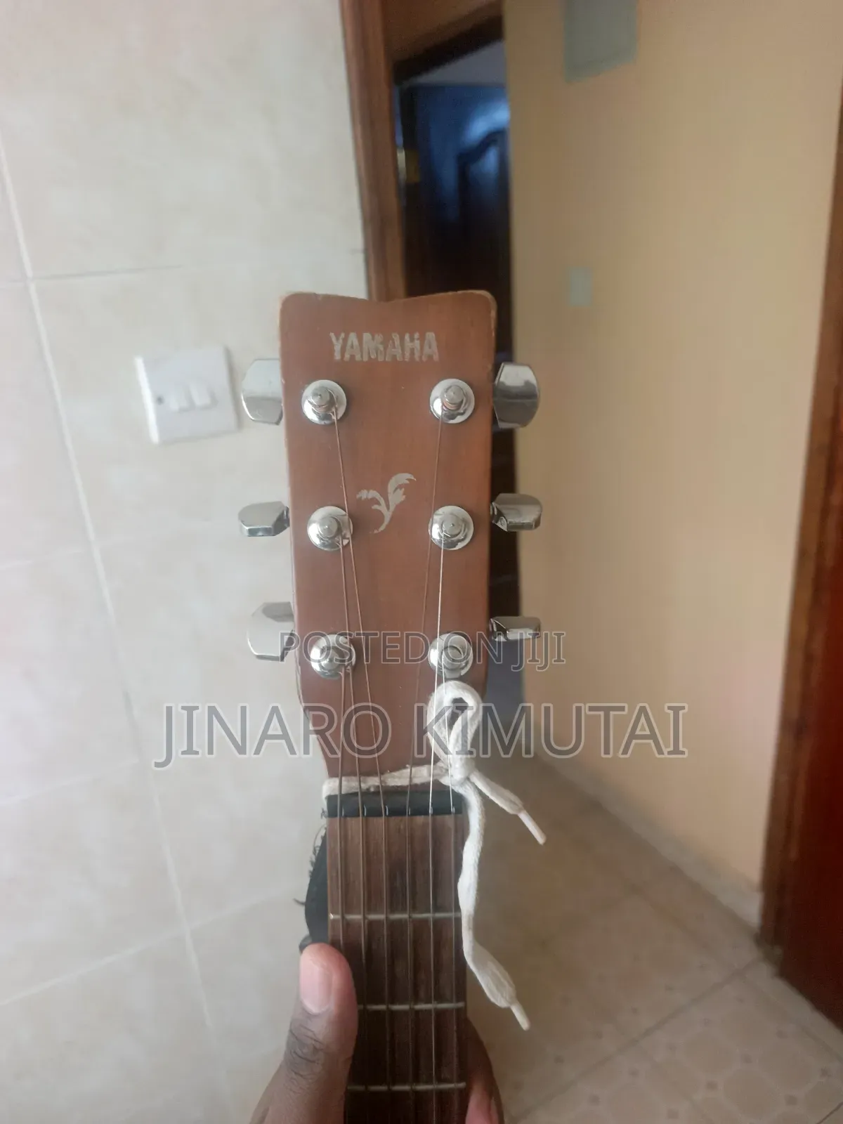 Yamaha Acoustic Guitar With a Capo.