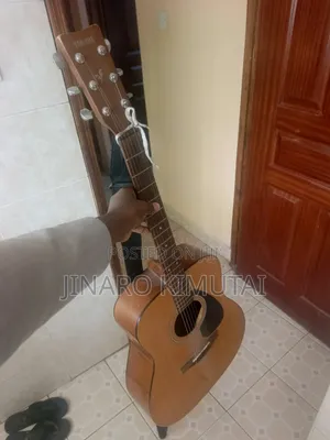 Yamaha Acoustic Guitar With a Capo.