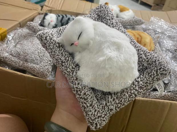 Dashboard Faux Fur Styled Curled Up Sleeping Kitten Position