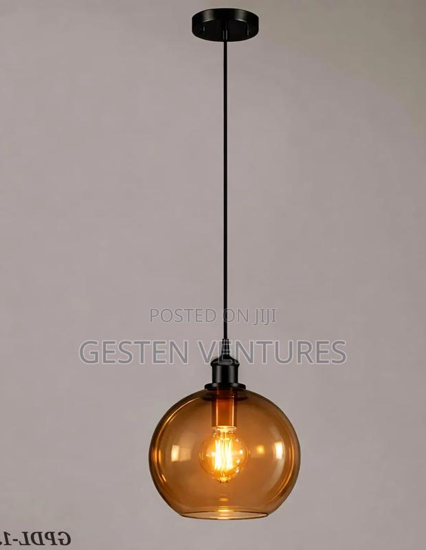Amber Glass Globe Shade and a Black Metal Finish Pendant Light