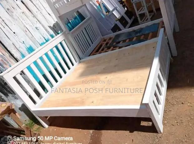 White Wooden 5 by 6 Bed