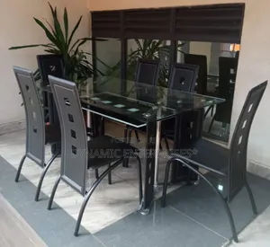 Executive 6 Sitter Glass Dinning Table With Leather Seat