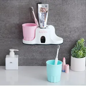 Toothbrush Holder With Toothpaste Dispenser.