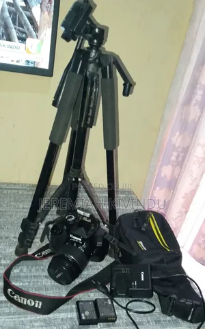 Canon EOS 4000D DSLR Camera + 2 Batteries + Charger + Tripod