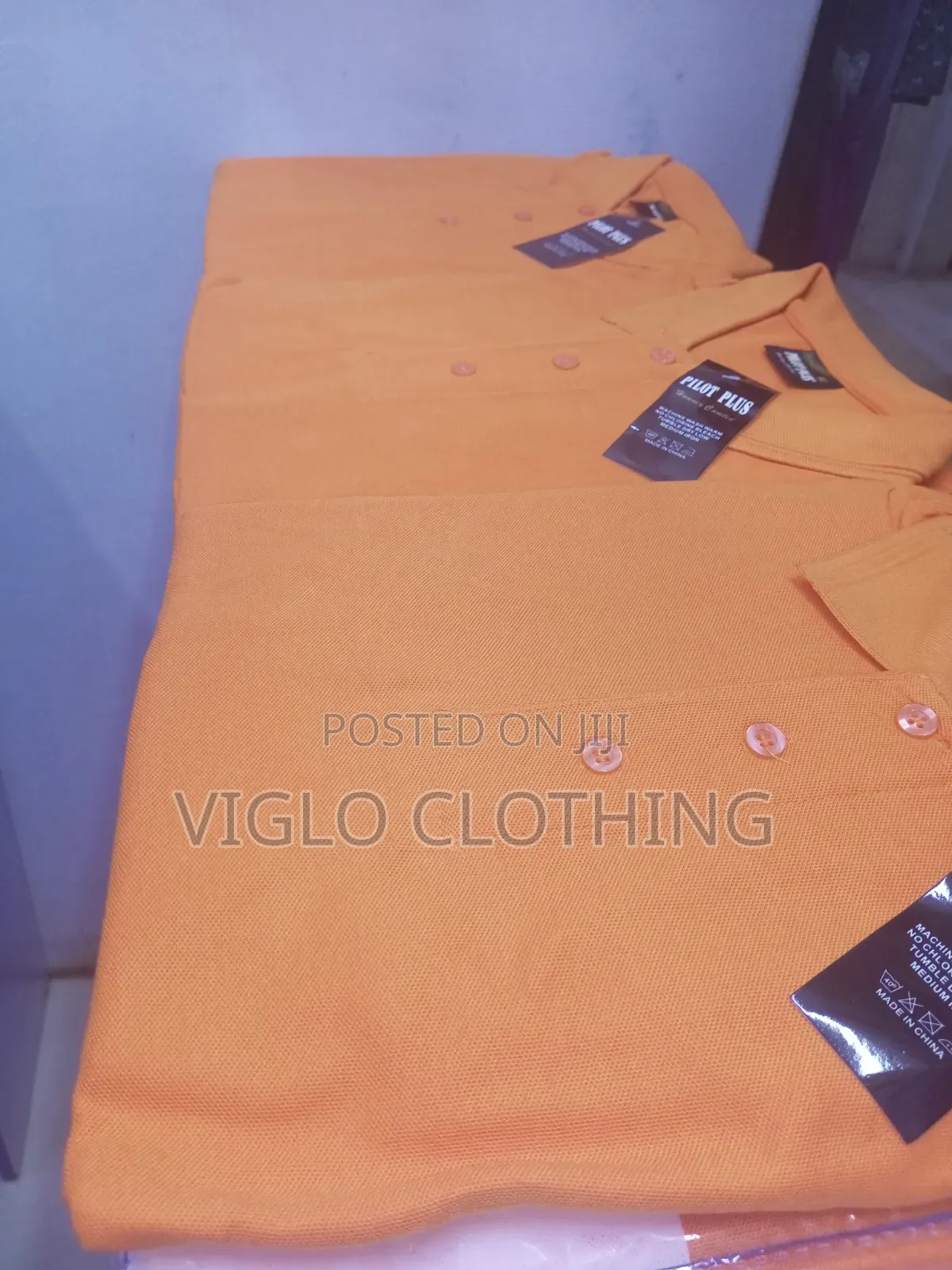 Orange Poloshirts in Wholesale and Single Orders
