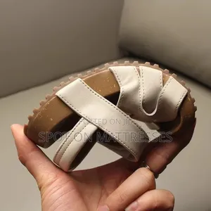 Kids' Modern Sandals. Sizes 26-36. Available in Cream and Black.
