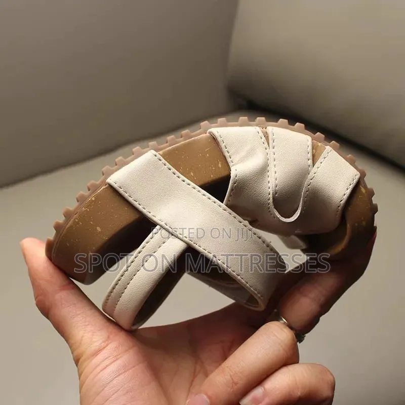 Kids' Modern Sandals. Sizes 26-36. Available in Cream and Black.