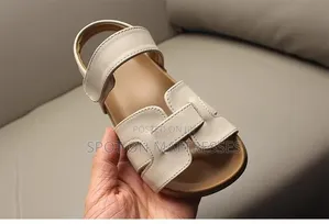 Kids' Modern Sandals. Sizes 26-36. Available in Cream and Black.