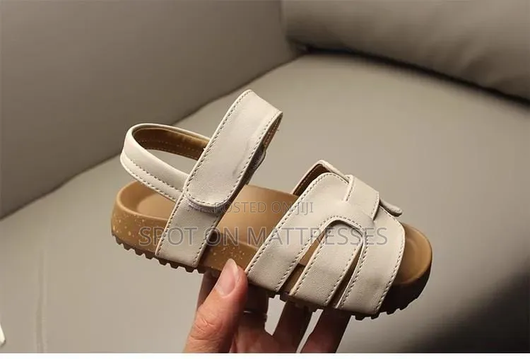Kids' Modern Sandals. Sizes 26-36. Available in Cream and Black.
