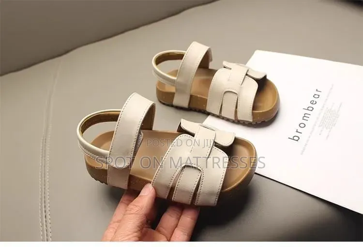 Kids' Modern Sandals. Sizes 26-36. Available in Cream and Black.
