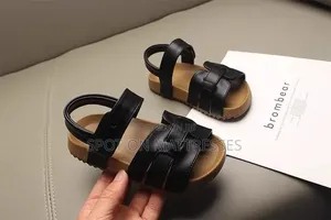 Kids' Modern Sandals. Sizes 26-36. Available in Cream and Black.