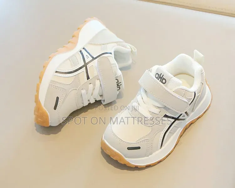 Children Sneakers in Colours White and Black. Delivery Available.
