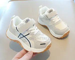 Children Sneakers in Colours White and Black. Delivery Available.