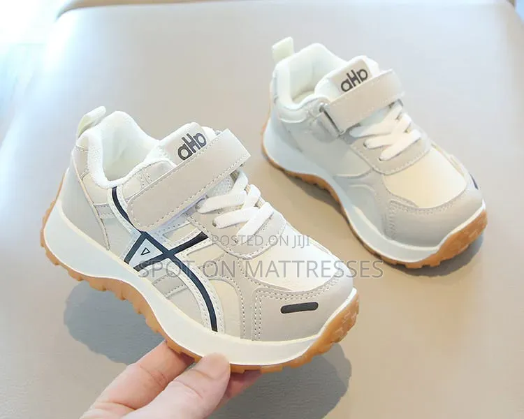 Children Sneakers in Colours White and Black. Delivery Available.