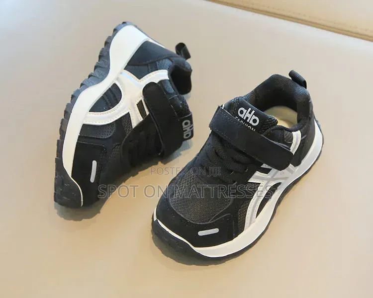Children Sneakers in Colours White and Black. Delivery Available.