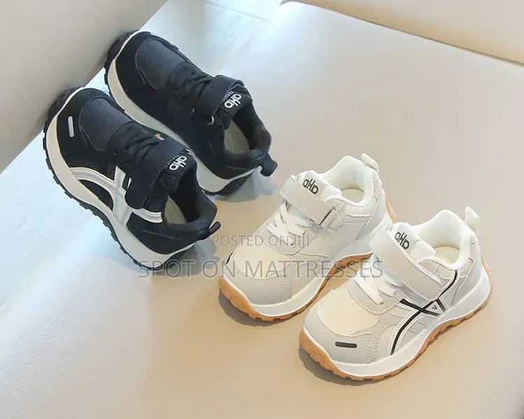 Children Sneakers in Colours White and Black. Delivery Available.