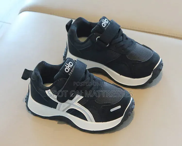 Children Sneakers in Colours White and Black. Delivery Available.