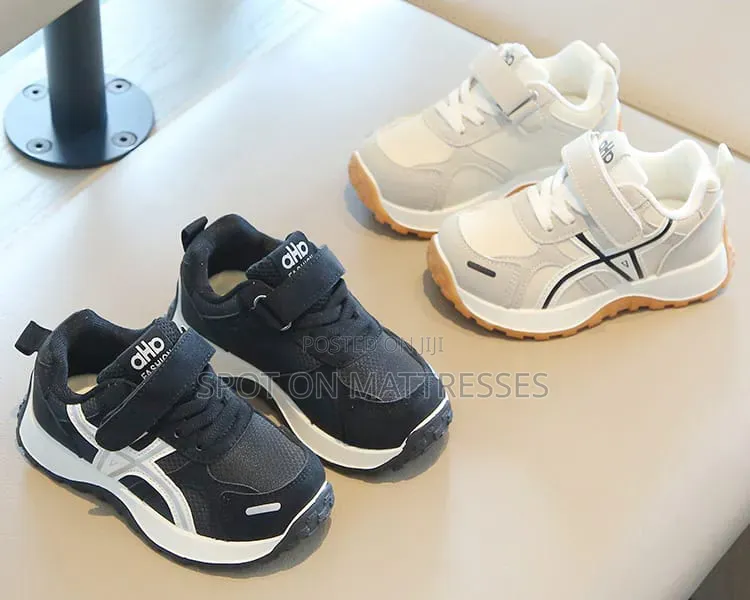 Children Sneakers in Colours White and Black. Delivery Available.
