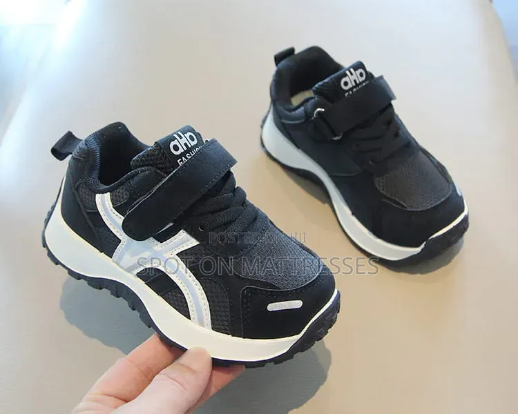 Children Sneakers in Colours White and Black. Delivery Available.