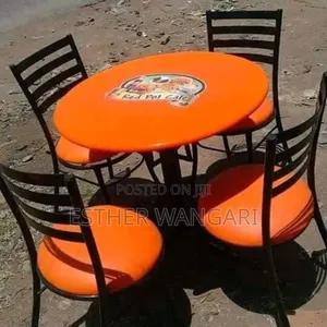 A Set of Orange Color Seats and a Table