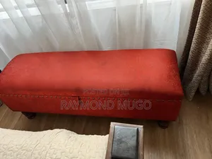Rust Upholstered Storage Ottoman