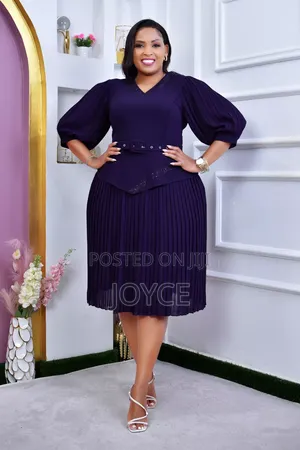 Pleated Dress With Peprum
