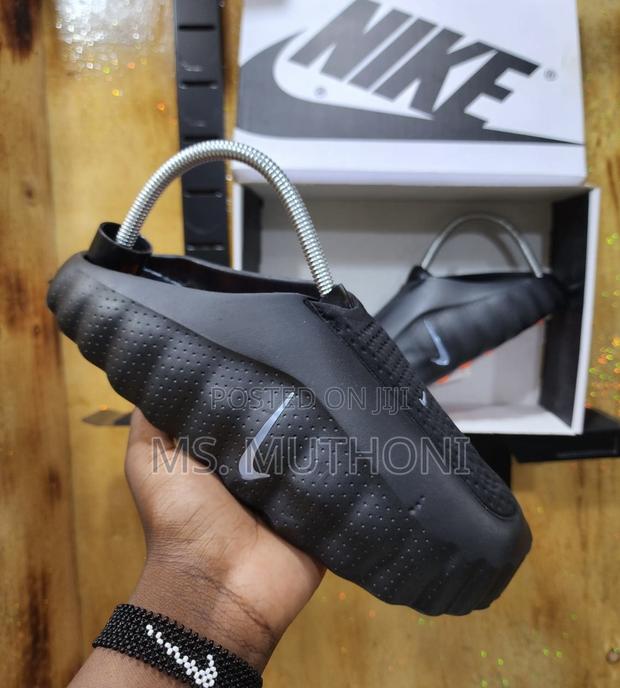 Boxed Innovative Massage Sole and a Chunky Profile Nike Mind Slides - thumbnail 2