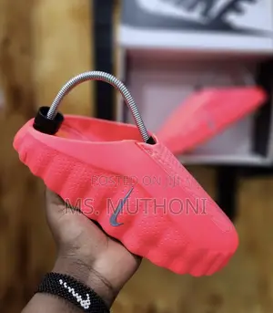 Boxed Innovative Massage Sole and a Chunky Profile Nike Mind Slides