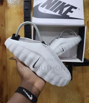Boxed Innovative Massage Sole and a Chunky Profile Nike Mind Slides