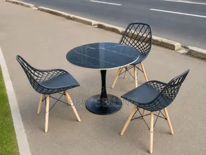 Modern Round Table With Metallic Base and Dining Chairs