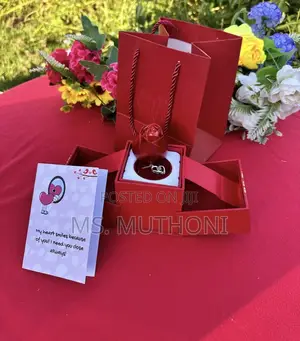 An "I Love You in 100 Languages" Rotating Rose Jewelry Gift Box Set.
