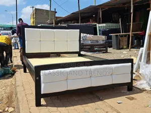 Black Frame and White Tufted 4x6 Bed
