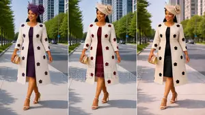 A Women’s Longline Coat With a Fitted Dress