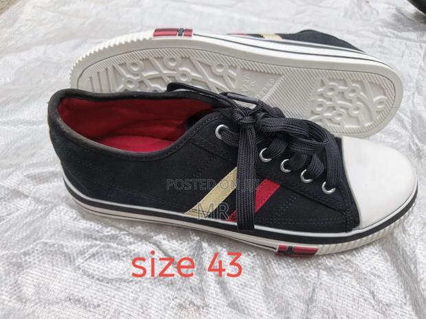 Cream Convers $ Rubber Shoes - main view
