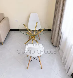 Modern Round Glass Dining Table Set With White Eames Chairs