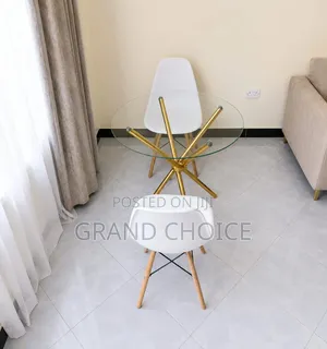 Modern Round Glass Dining Table Set With White Eames Chairs