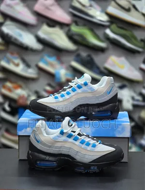 Nike Air Max 95 Sneakers in a "Laser Blue" or "Blue Spark" Colorway.