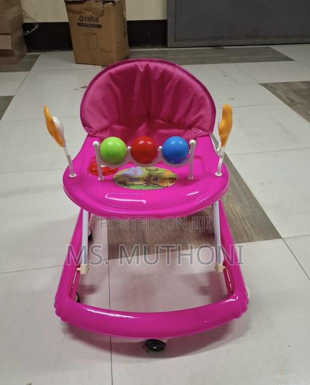 Baby Walker Equipped With a Supportive Fabric Seat a Rolling Base - main view