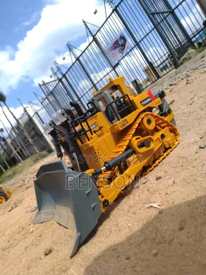 Toy Bulldozer Truck With Articulated Wheels, Lights and Engine Sound