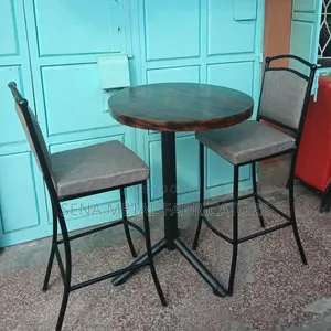 Bar Table Set With a Patterned Wooden Top.
